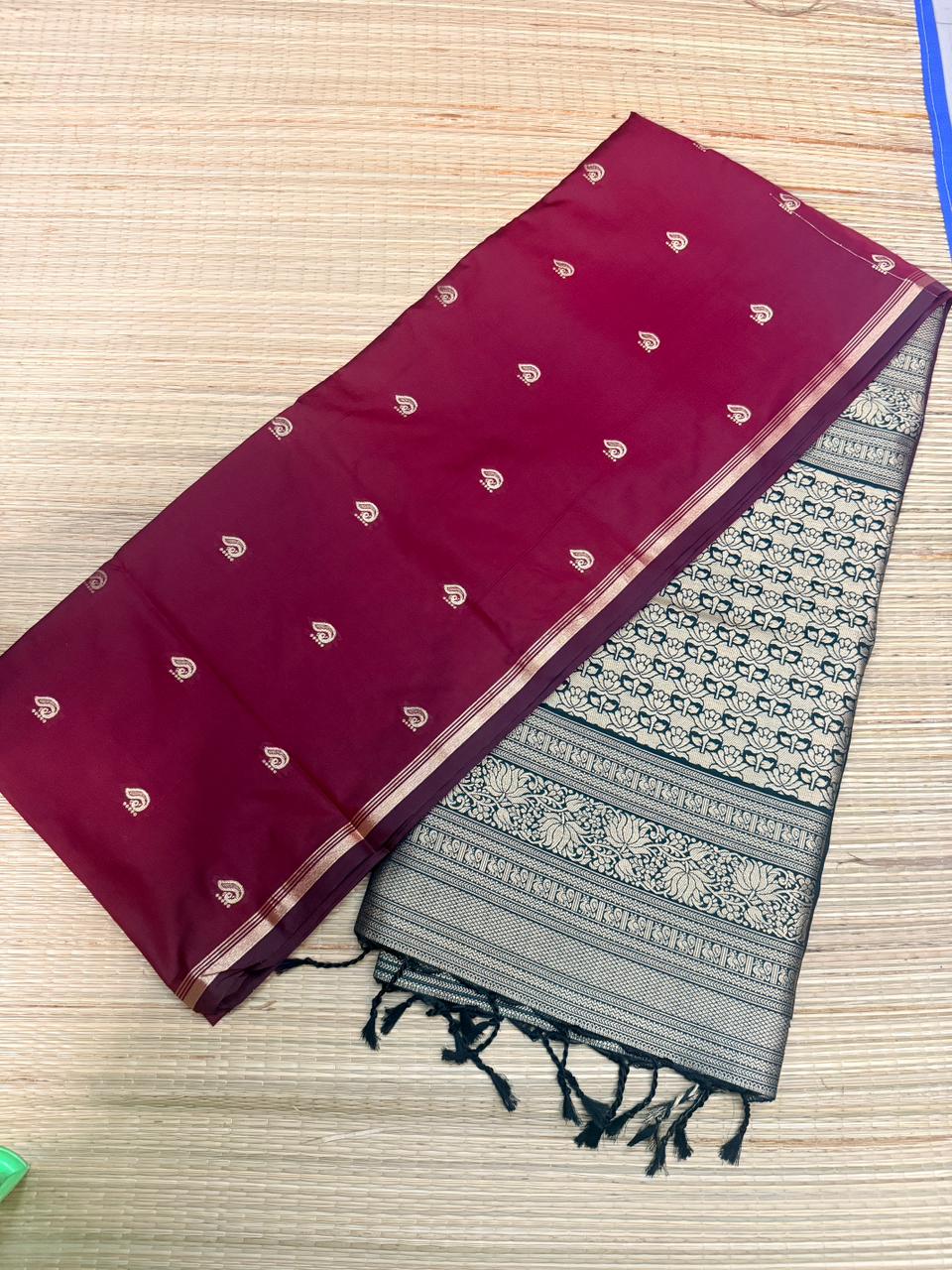 Reddish Maroon Soft Silk Saree with Paisley Butta & Black Antique Zari Pallu