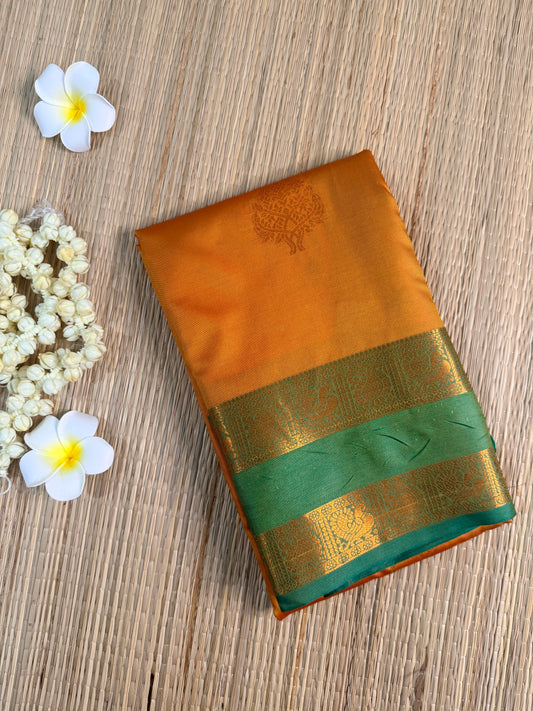 Mustard Orange Semi Silk Saree with Gold Zari Butta & Teal Contrast Border