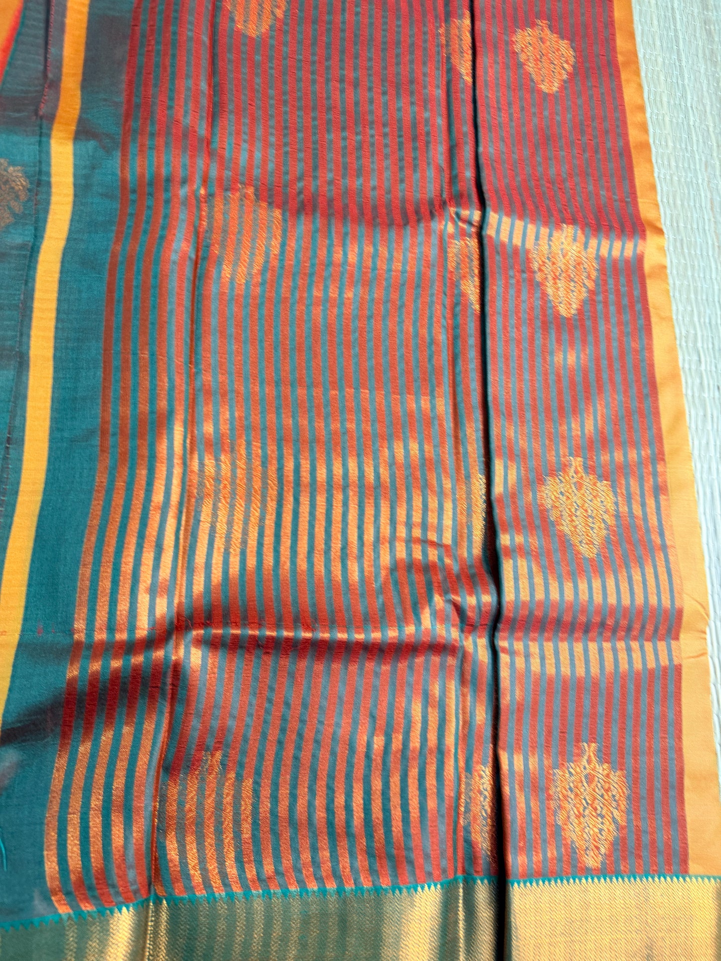 Mustard Orange Semi Silk Saree with Gold Zari Butta & Teal Contrast Border
