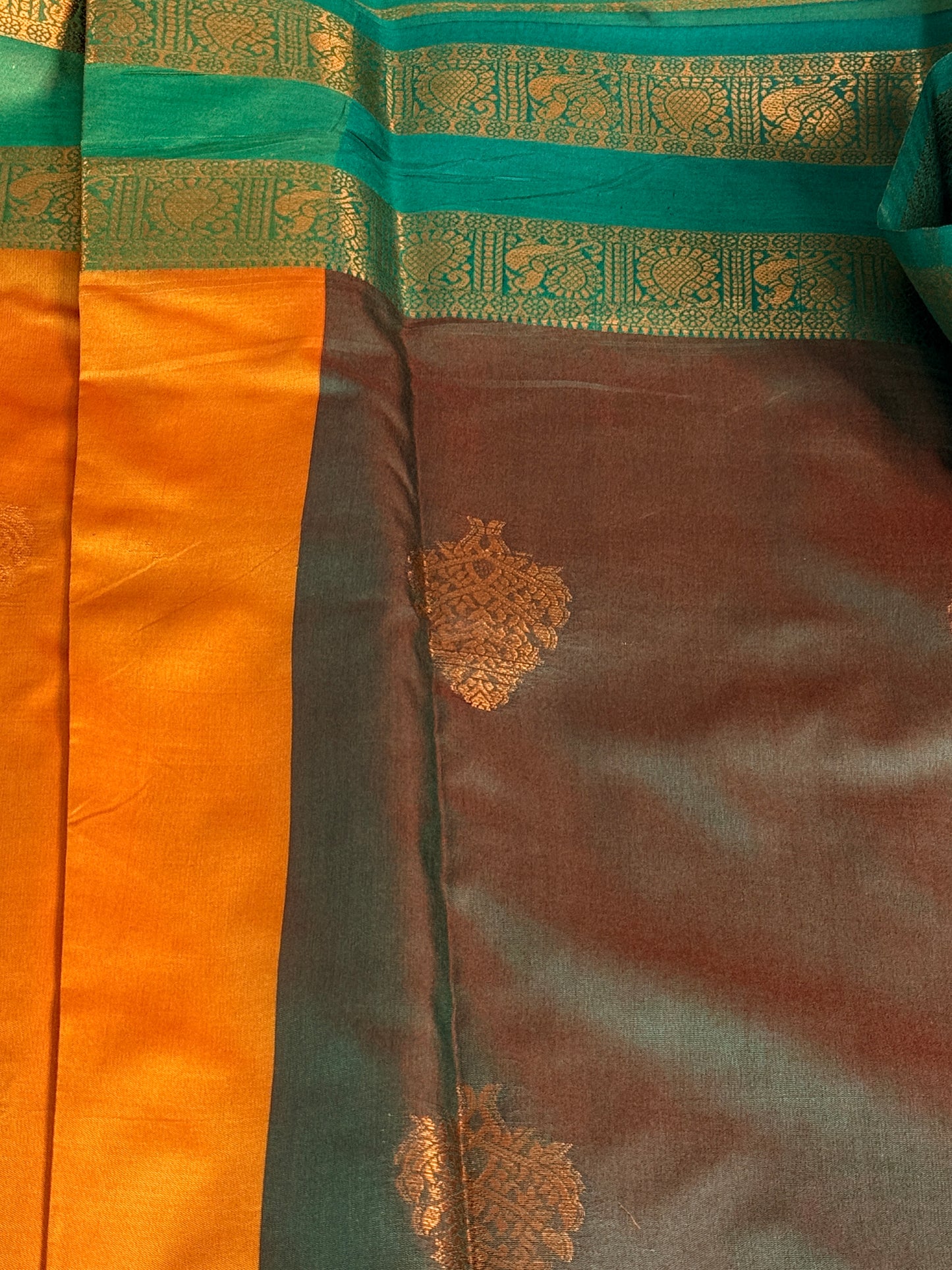 Mustard Orange Semi Silk Saree with Gold Zari Butta & Teal Contrast Border