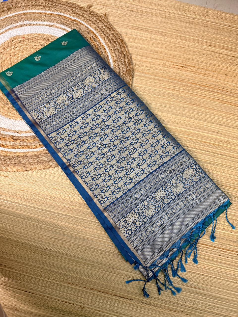 Teal Green Soft Silk Saree with Paisley Butta & Navy Blue Antique Zari Pallu